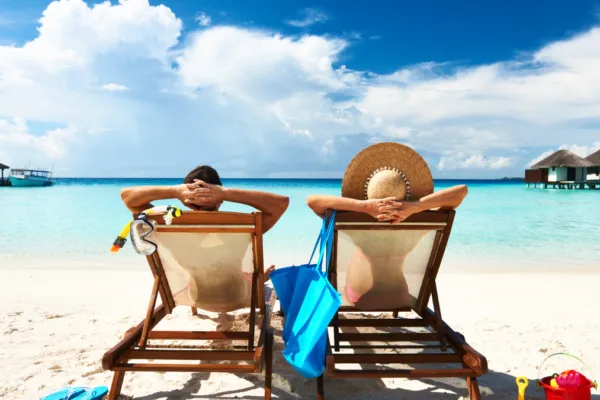 Man and Woman relaxing on a beach